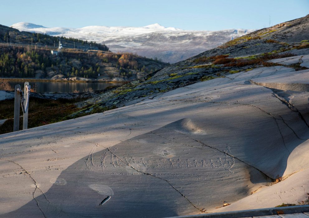 Rock carvings in Hjemmeluft in Alta: Landscape with boat image. Photo: Arve Kjersheim, the Directorate of Cultural Heritage