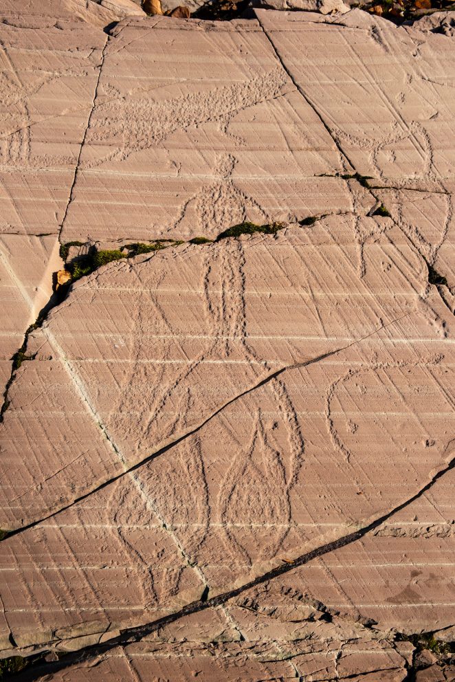 Rock carvings in Kåfjord in Alta: Person with snowshoes. Photo: Arve Kjersheim, the Dircetorate for Cultural Heritage