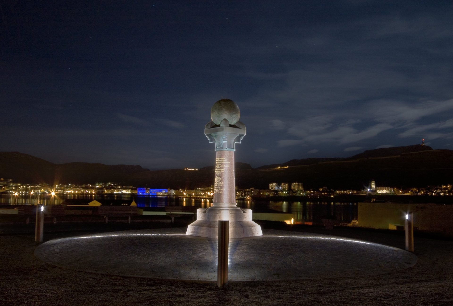 Photo of the Struve Geodetic Arc at night. The monument in Hammerfest marks the northernmost mainland point on the Struve Geodetic Arc. Photo: Zenisk